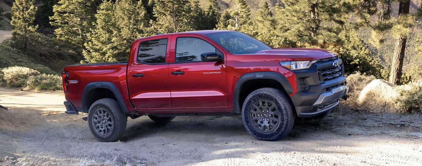 A red 2023 Chevy Colorado Trail Boss is shown parked.