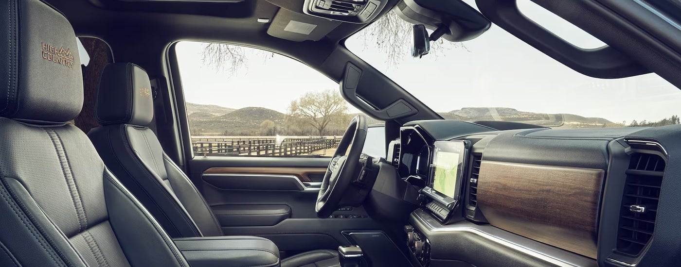 Side view of the brown leather interior of a 2024 Chevy Silverado 1500 High Country for sale.